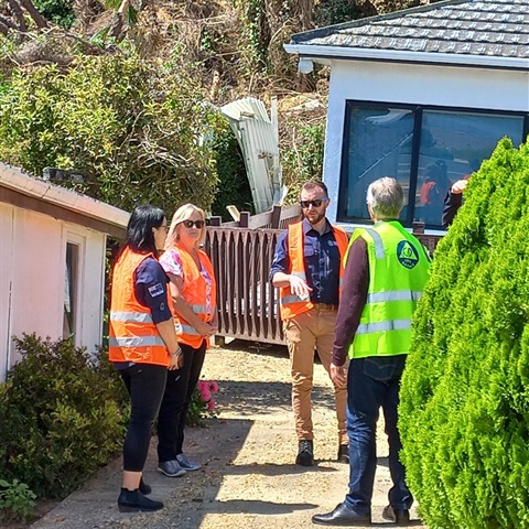 Inspecting red stickered property on the Thames Coast Rd.jpg